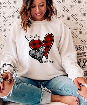 Love Never Fails Valentine Sweatshirt
