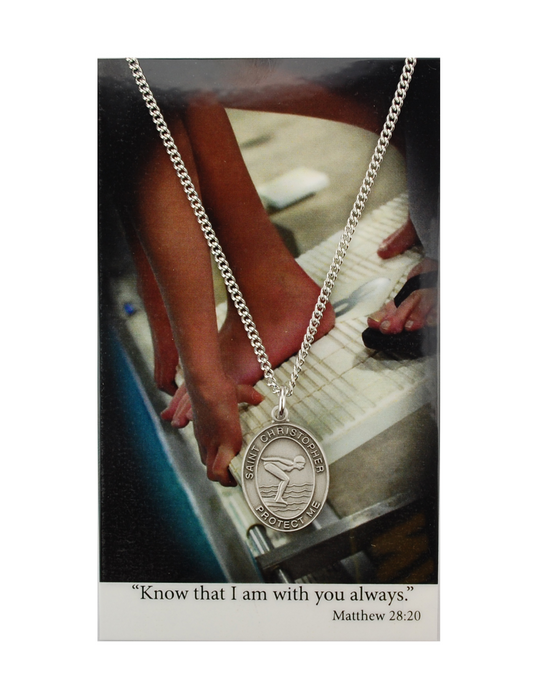 St. Christopher Girls Swimming Necklace made from pewter and a 18" silvertone chain with a laminated prayer card perfect gift to girls who loves sports to your sister family and friends for birthdays or any occasion